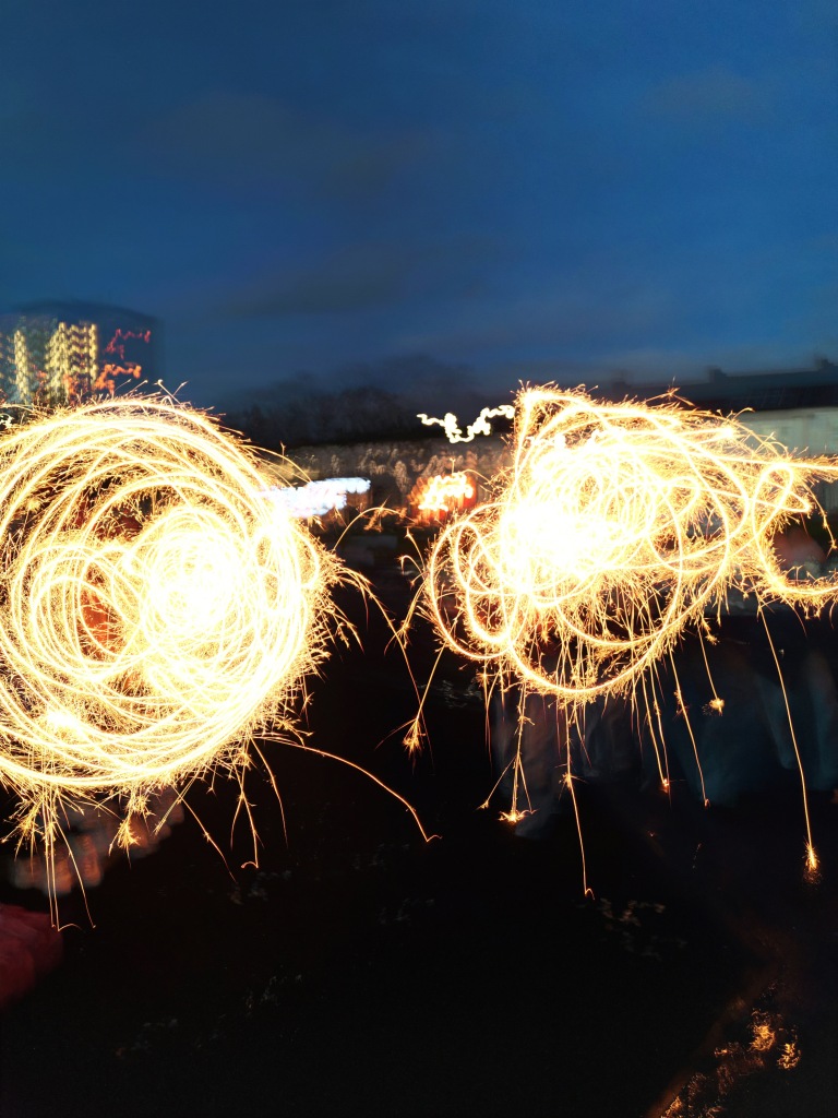 Sparkler light painting from two musicians who have scribbled all over 